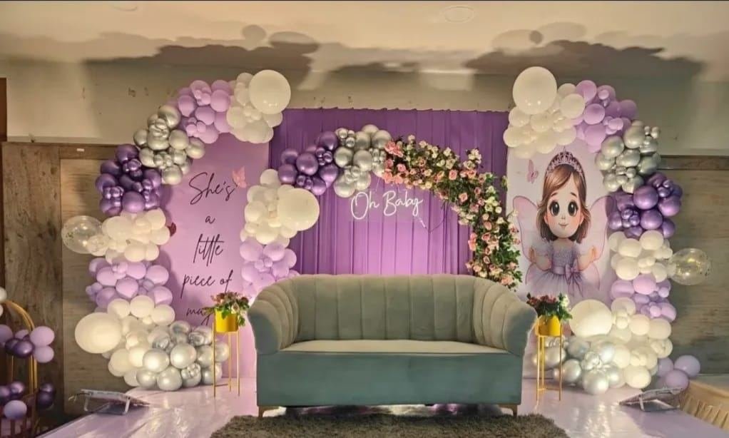 Oh Baby balloon and floral baby shower decoration with lounge seating
