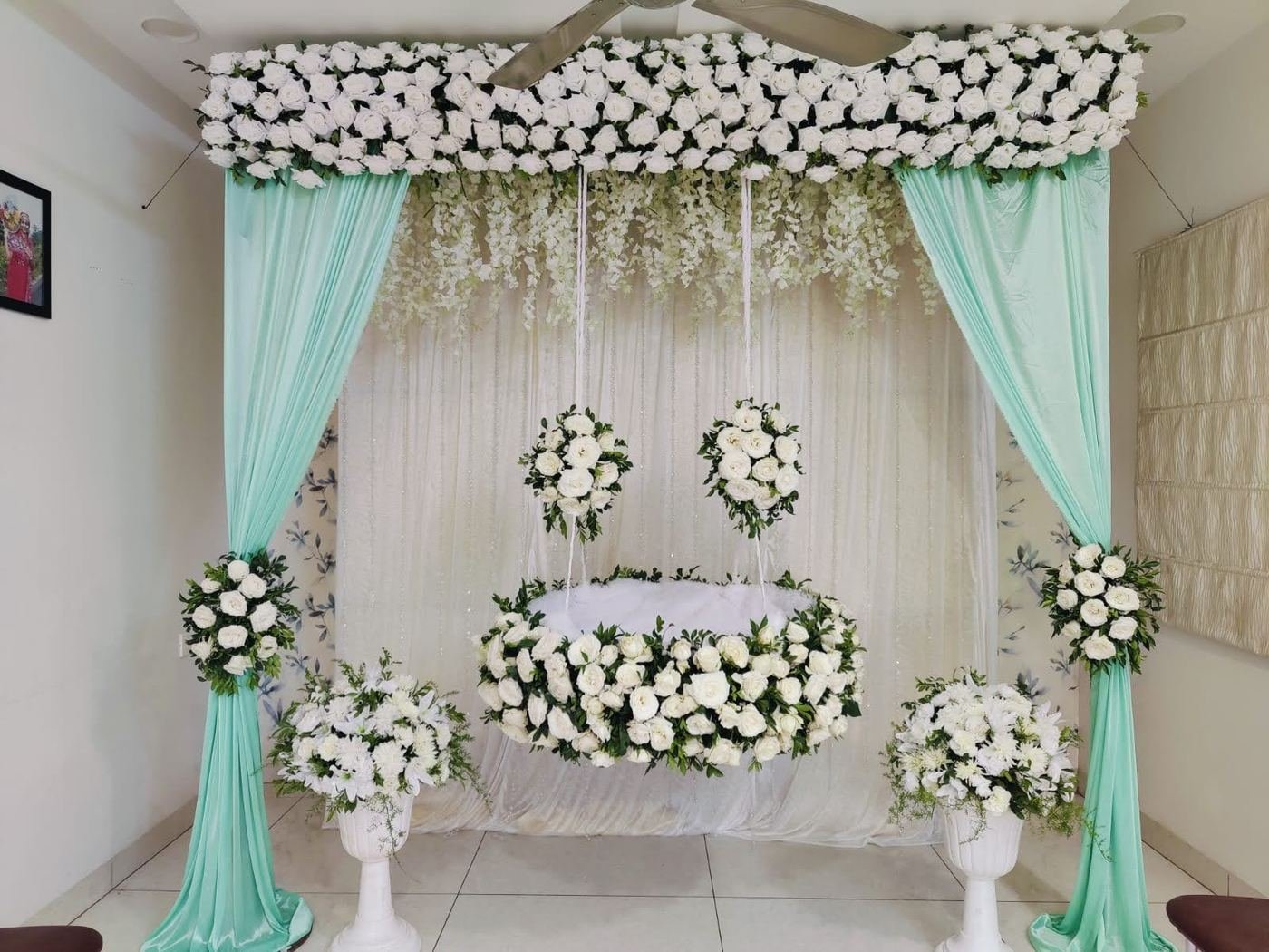 Elegant white rose cradle swing decoration for naming ceremony