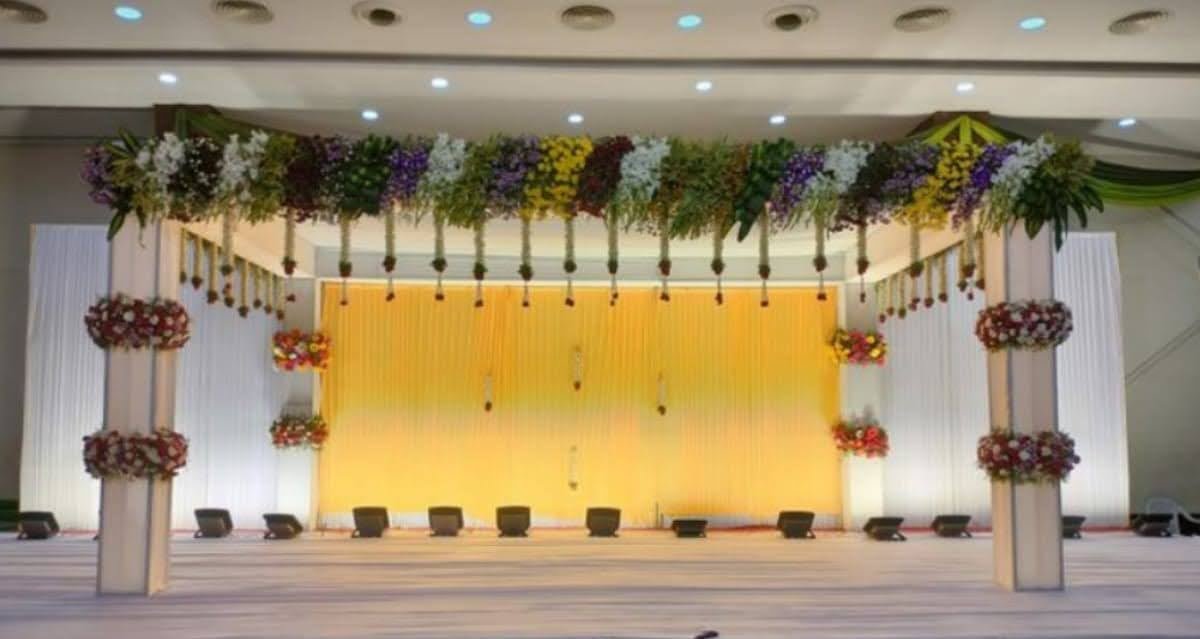 Wedding mandap with colourful floral canopy top